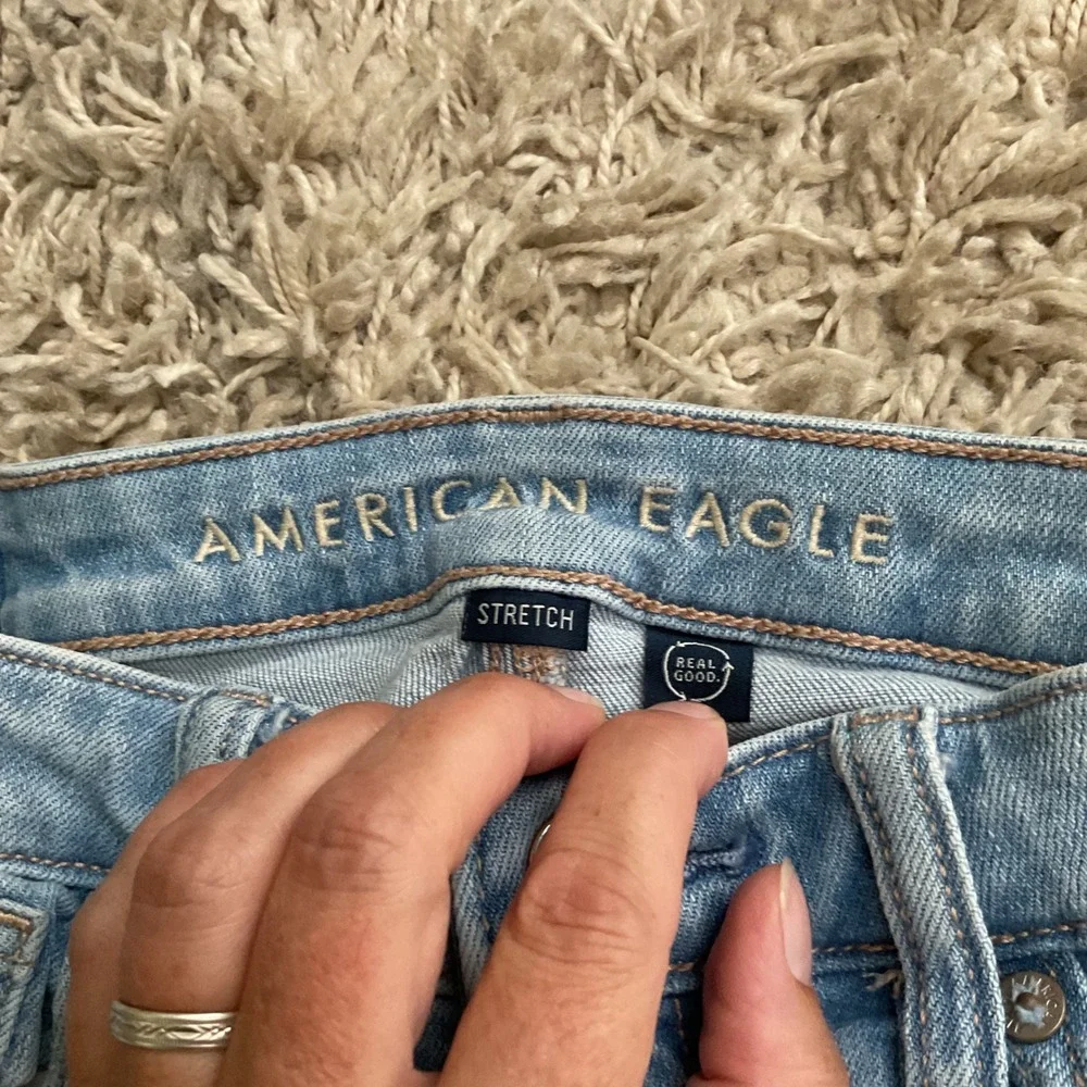 American Eagle Light Wash High Rise Flare Jeans Raw Released Hem Size 00 Regular